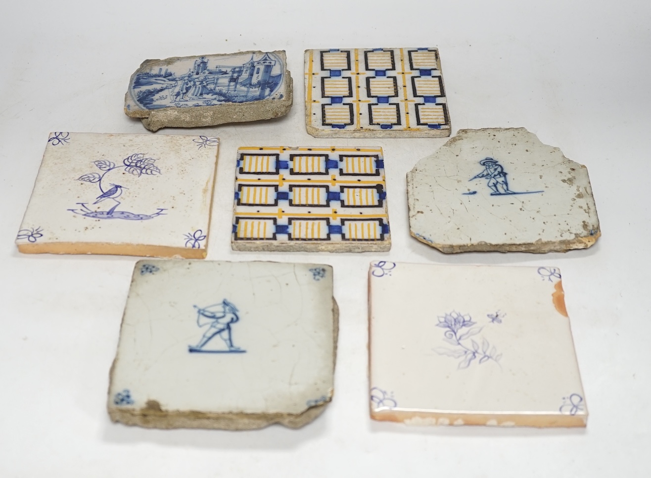 From the Studio of Fred Cuming. A group of tiles, mostly 19th / 20th century Delft, largest 23 x 23cm. Condition - fair